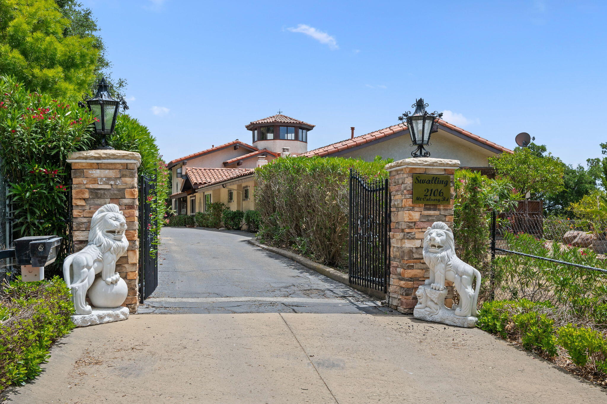 2106 Mt Calvary Road Santa Barbara, CA 93105 - Photo 4 of 66 a front view of a house with a yard and garage