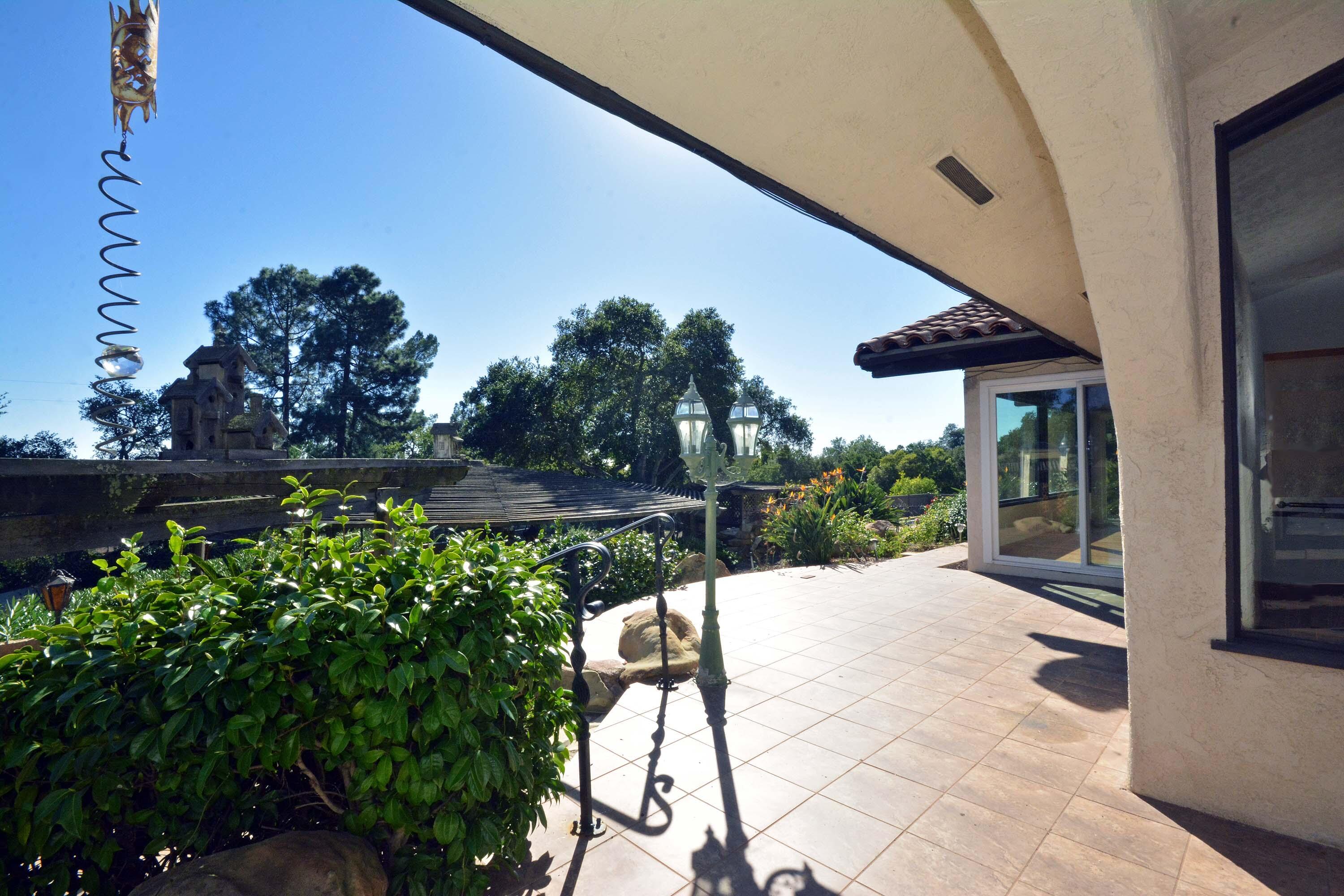 2106 Mt Calvary Road Santa Barbara, CA 93105 - Photo 51 of 66 a view of a patio with table and chairs and potted plants