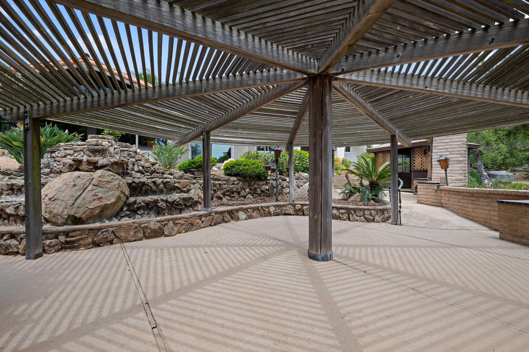 2106 Mt Calvary Road Santa Barbara, CA 93105 - Photo 63 of 66 a view of a patio with table and chairs a barbeque with wooden floor and roof with barbeque grill