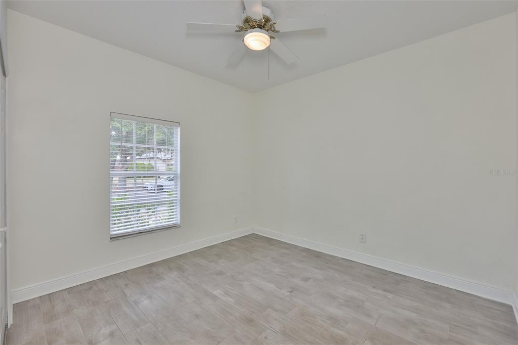 708 Coade Stone Drive Seffner, FL 33584 - Photo 24 of 48 an empty room with a window