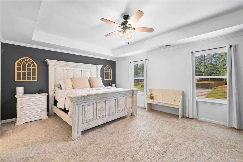 13 Four Feathers Lane Northeast Rydal, GA 30171 - Photo 28 of 51 a bedroom with a white bed and a large window
