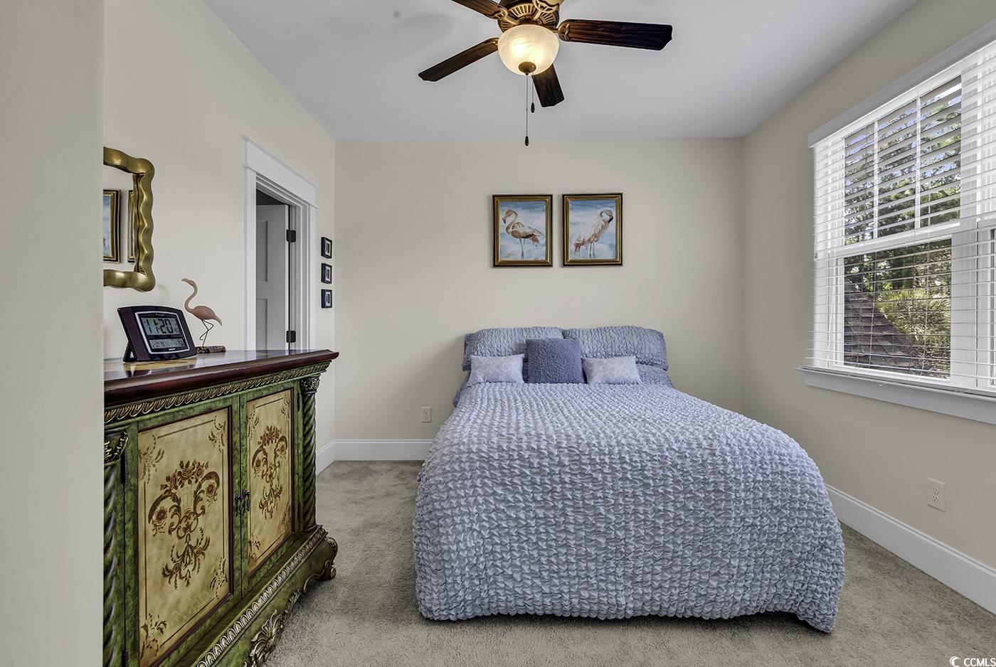 296 Chamberlin Road Myrtle Beach, SC 29588 - Photo 23 of 40 Carpeted bedroom with ceiling fan