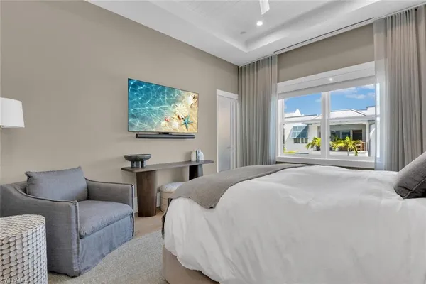 a bedroom with furniture and a window