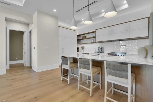 a kitchen with a table and chairs in it