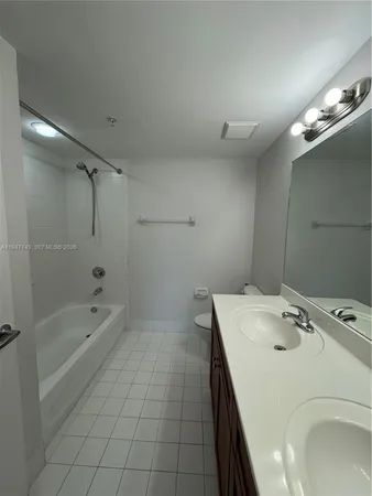a bathroom with a sink a toilet and bathtub