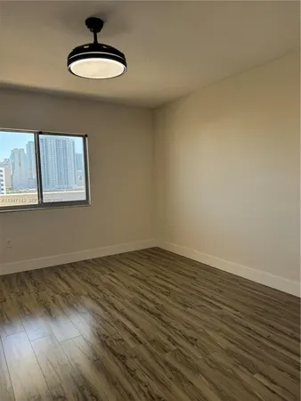 a view of wooden floor in an empty room