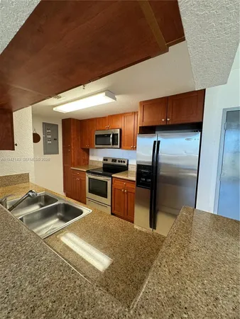 a view of kitchen with furniture and floor to ceiling window