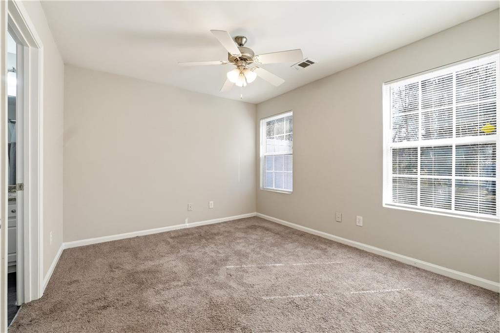 1468 Box Circle Winder, GA 30680 - Photo 12 of 25 an empty room with a window and a ceiling fan