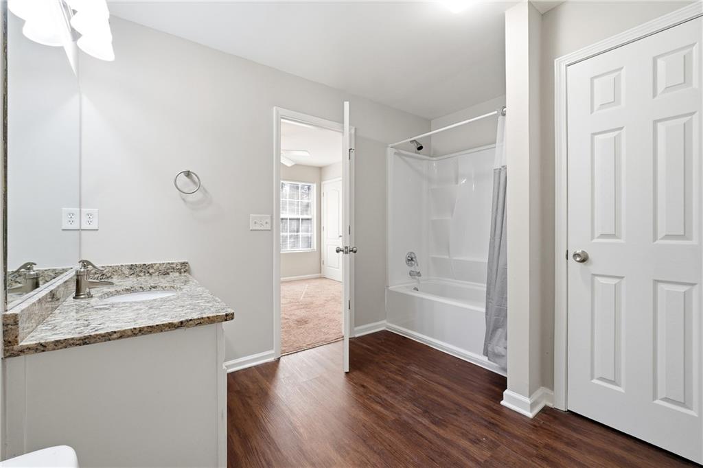 1468 Box Circle Winder, GA 30680 - Photo 15 of 25 a bathroom with a granite countertop sink toilet and shower