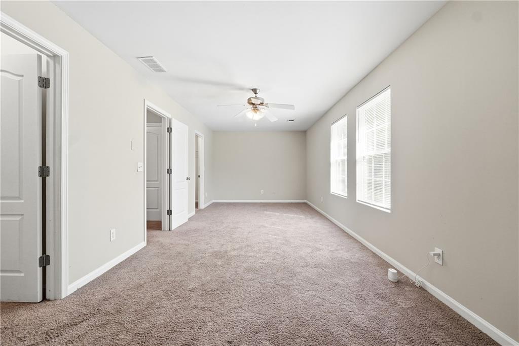 1468 Box Circle Winder, GA 30680 - Photo 19 of 25 a view of a livingroom with a ceiling fan and window