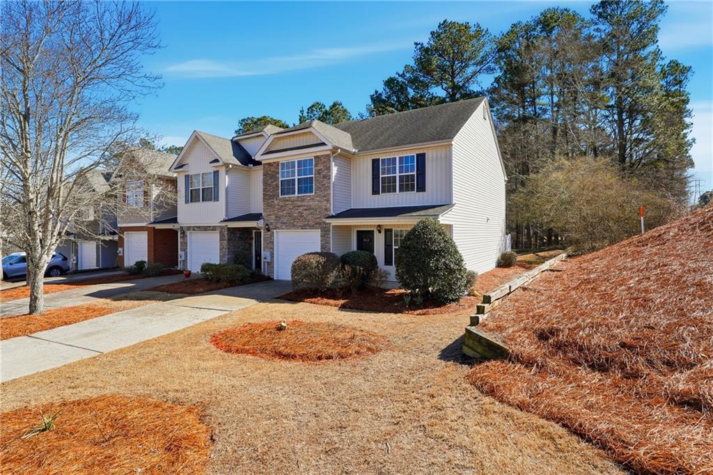 1468 Box Circle Winder, GA 30680 - Photo 2 of 25 a view of a white house with a yard covered in snow