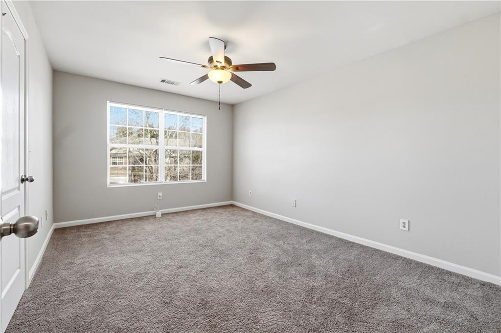 1468 Box Circle Winder, GA 30680 - Photo 21 of 25 an empty room with windows and fan
