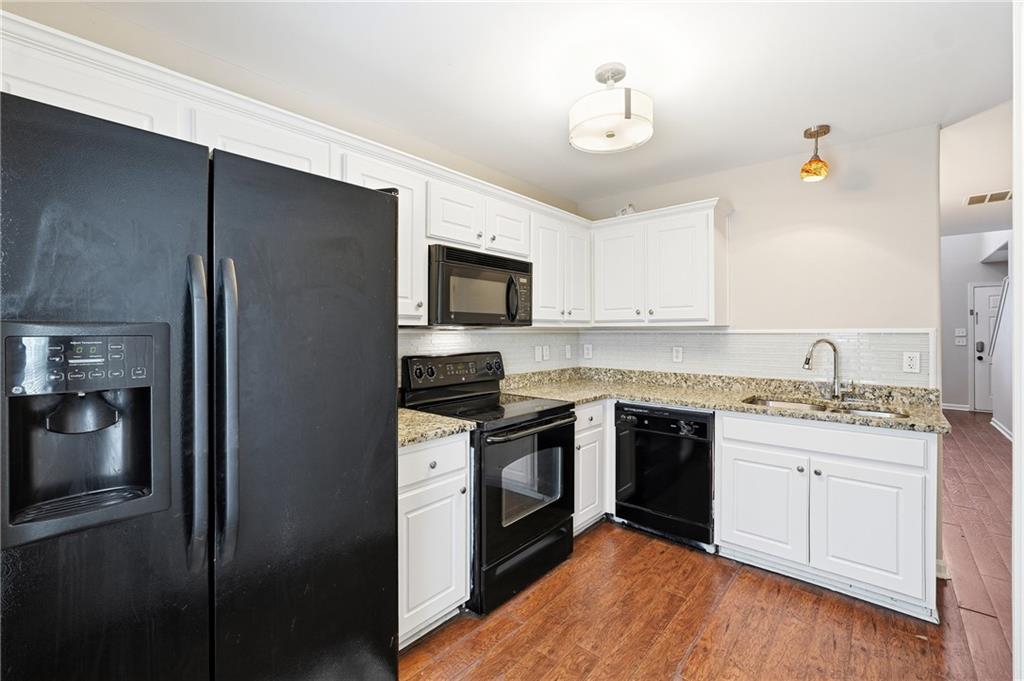 1468 Box Circle Winder, GA 30680 - Photo 9 of 25 a kitchen with a sink stove and refrigerator