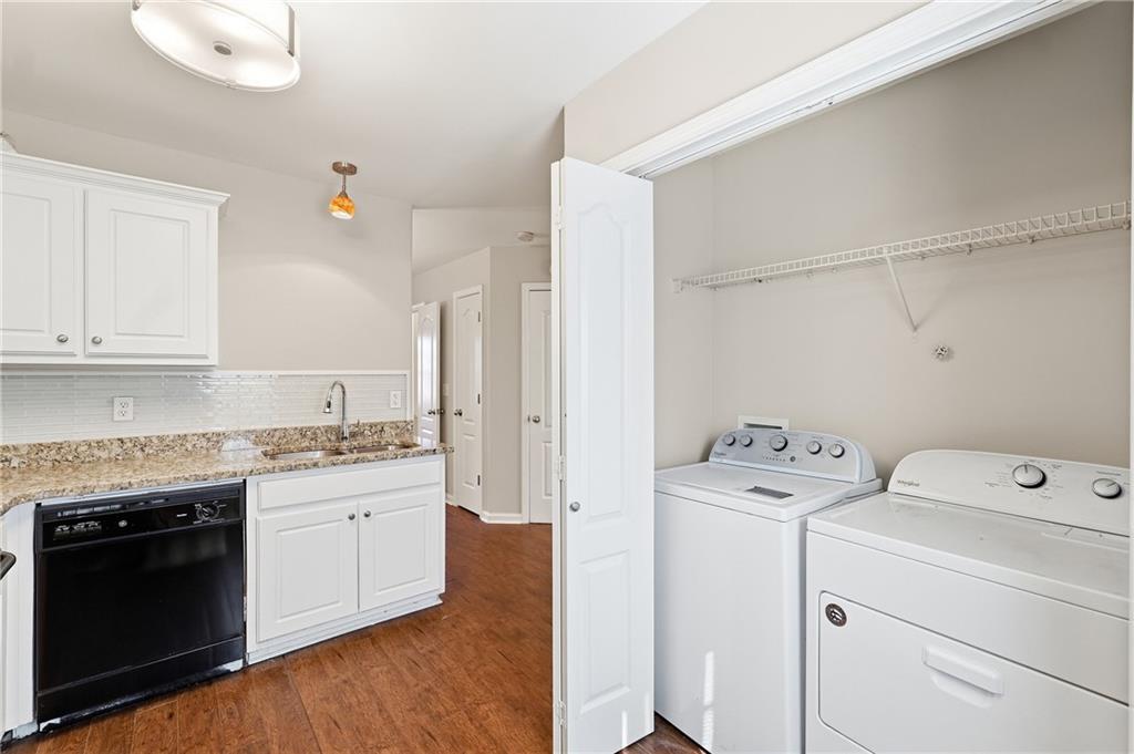 1468 Box Circle Winder, GA 30680 - Photo 10 of 25 a view of washer and dryer with kitchen view