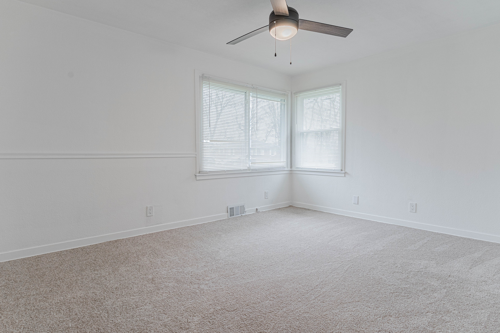 15324 South Corbin Street Plainfield, IL 60544 - Photo 13 of 26 an empty room with chandelier fan and windows