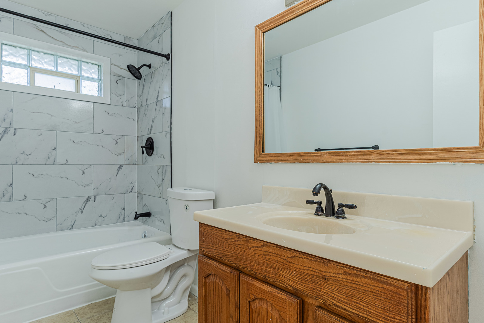 15324 South Corbin Street Plainfield, IL 60544 - Photo 15 of 26 a bathroom with a sink a toilet and shower