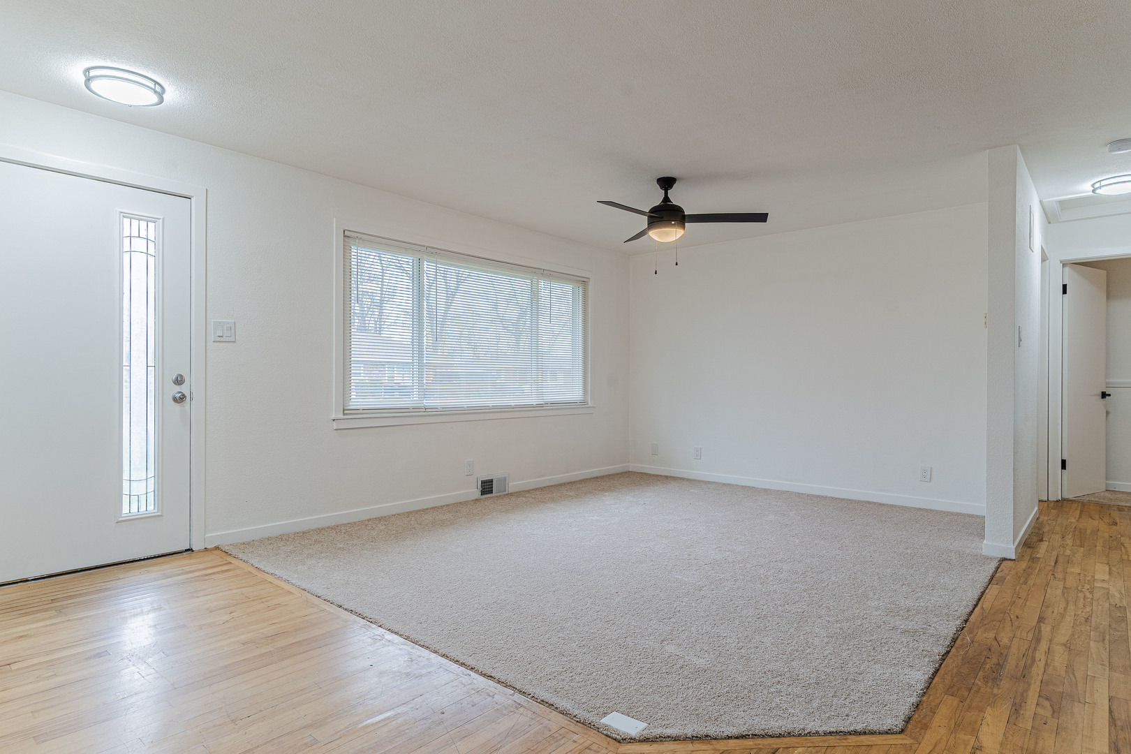 15324 South Corbin Street Plainfield, IL 60544 - Photo 5 of 26 wooden floor in an empty room with a window