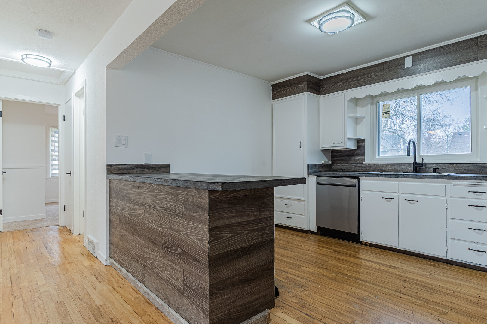 15324 South Corbin Street Plainfield, IL 60544 - Photo 7 of 26 a kitchen with granite countertop white cabinets and white appliances