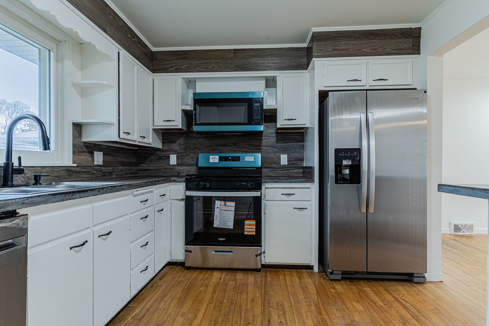 15324 South Corbin Street Plainfield, IL 60544 - Photo 9 of 26 a kitchen with stainless steel appliances a refrigerator sink and microwave