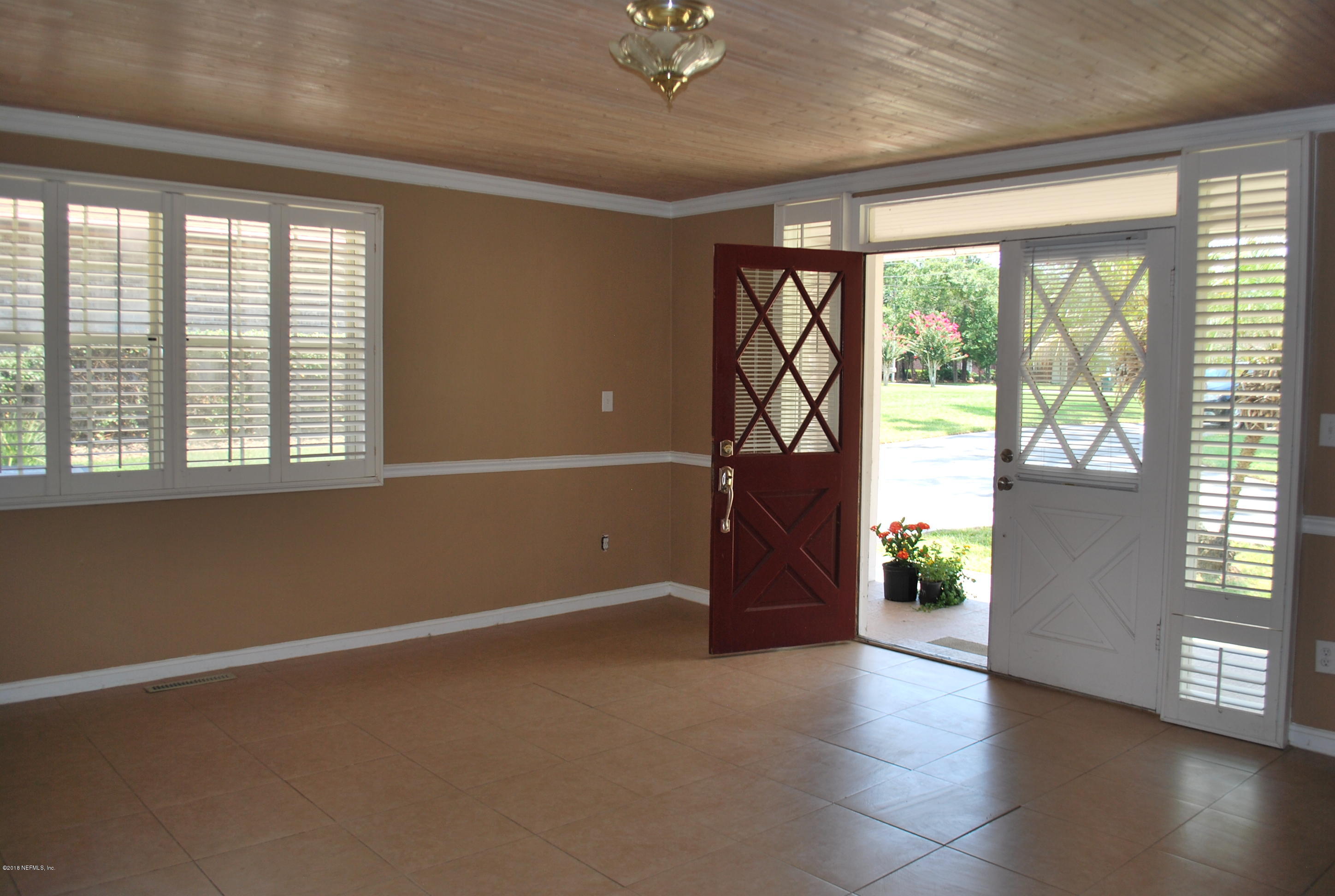 8811 Sanchez Road Jacksonville, FL 32217 - Photo 29 of 52 an empty room with windows and closet