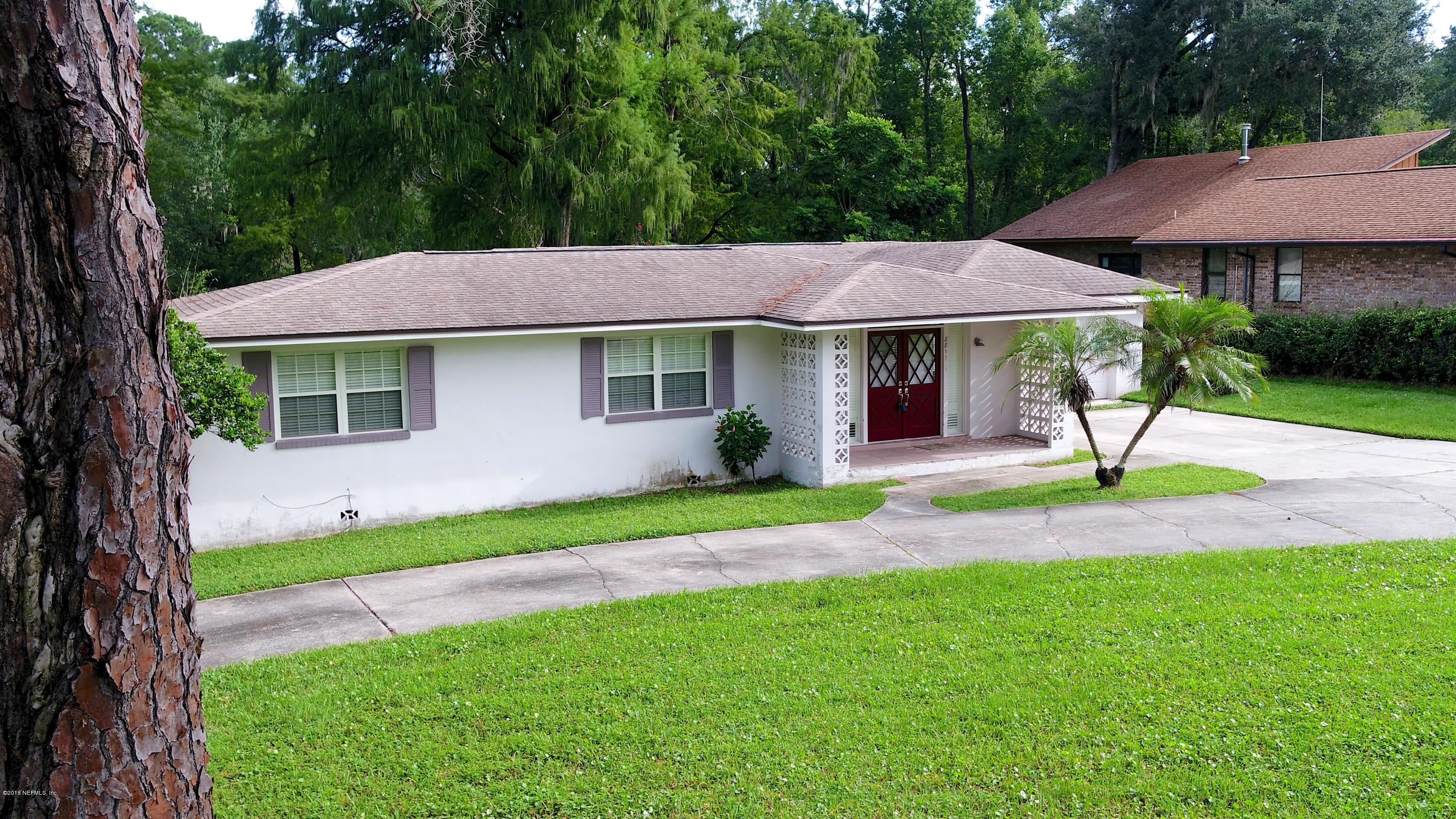 8811 Sanchez Road Jacksonville, FL 32217 - Photo 50 of 52 a front view of a house with a garden