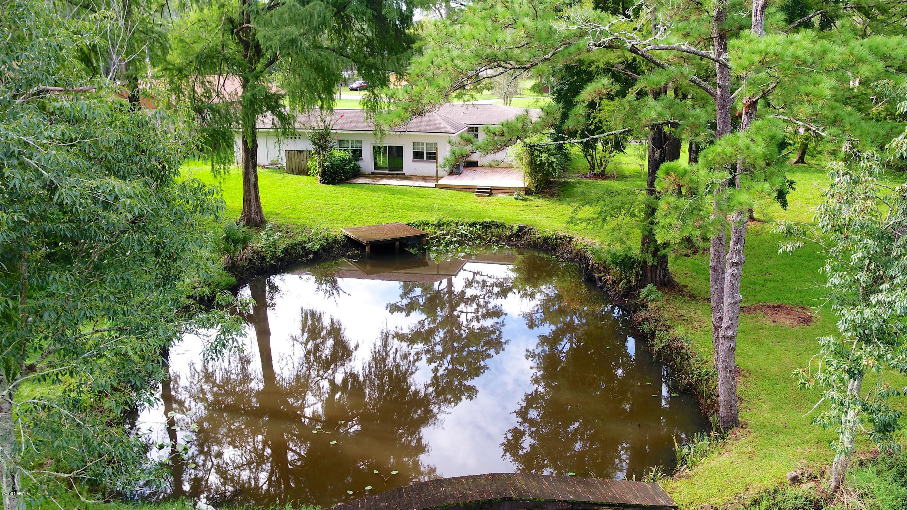 8811 Sanchez Road Jacksonville, FL 32217 - Photo 6 of 52 a view of a house with a yard