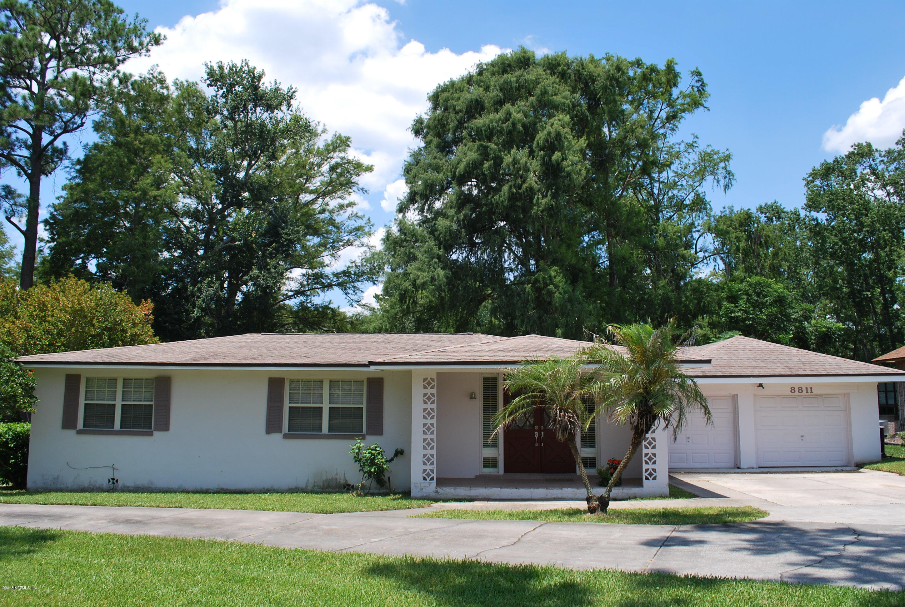 8811 Sanchez Road Jacksonville, FL 32217 - Photo 8 of 52 a front view of a house with a yard