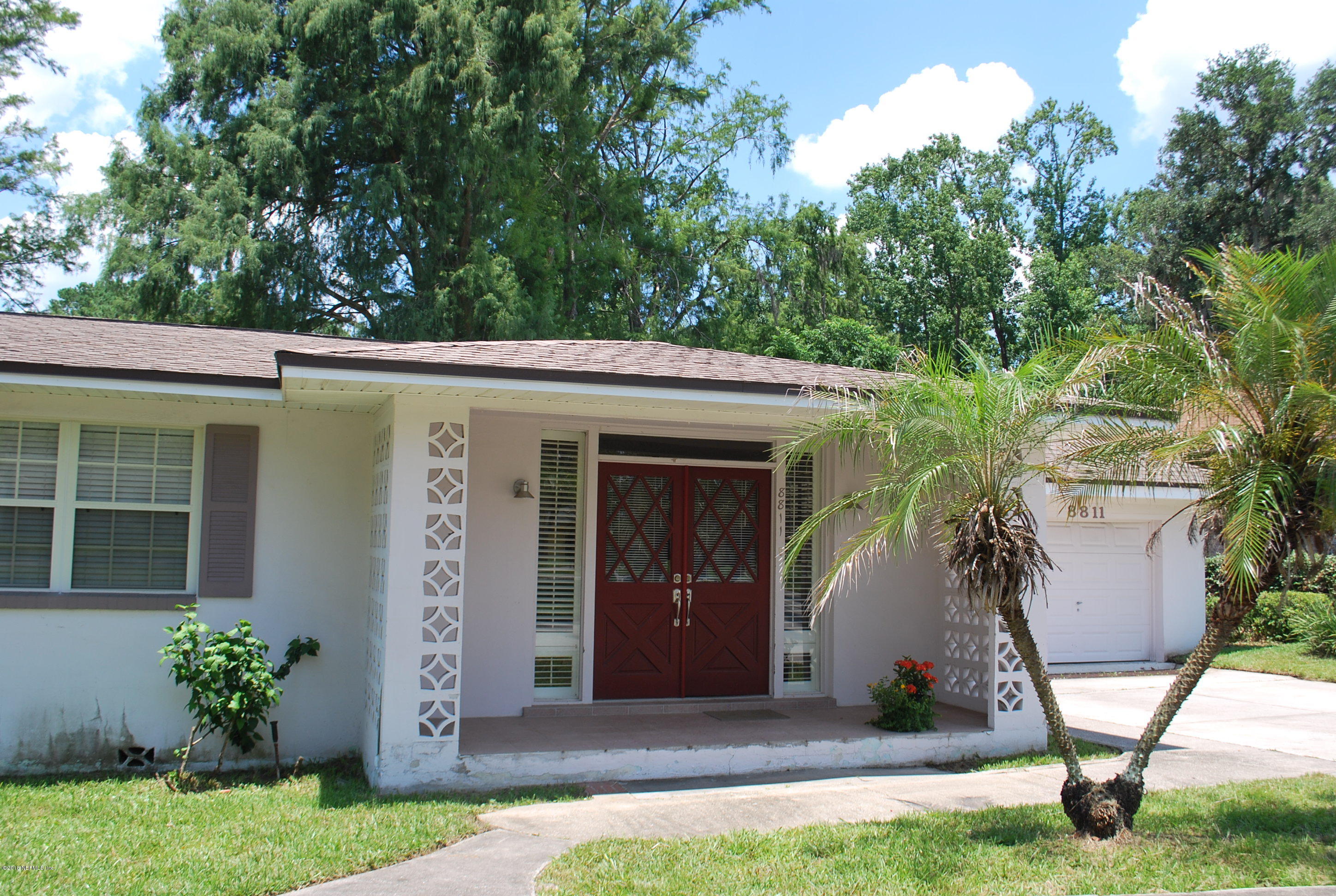 8811 Sanchez Road Jacksonville, FL 32217 - Photo 9 of 52 a front view of a house with garden