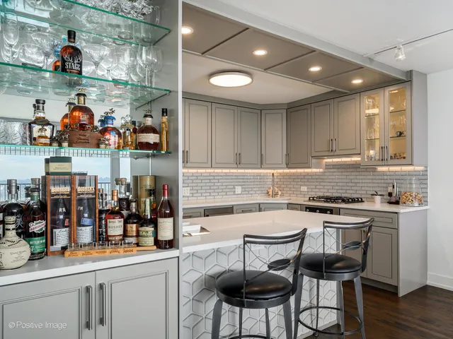 a kitchen with stainless steel appliances granite countertop a sink and cabinets