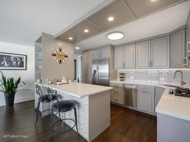 a kitchen with sink and cabinets