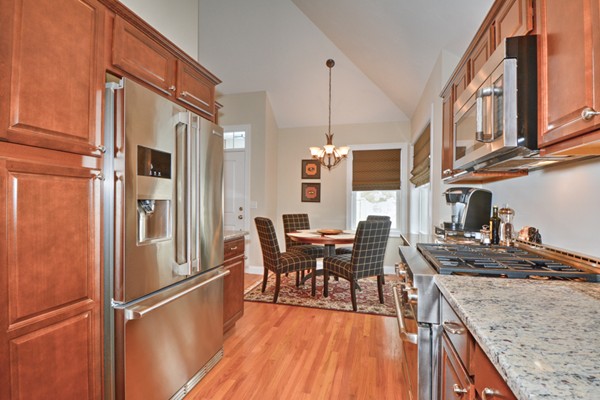 13 C Trail Ridge Way, Unit 47AR Harvard, MA 01451 - Photo 11 of 30 a kitchen with stainless steel appliances granite countertop a refrigerator a stove and a wooden floors