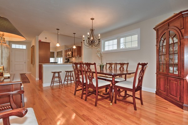 13 C Trail Ridge Way, Unit 47AR Harvard, MA 01451 - Photo 14 of 30 a view of a dining room with furniture window and wooden floor