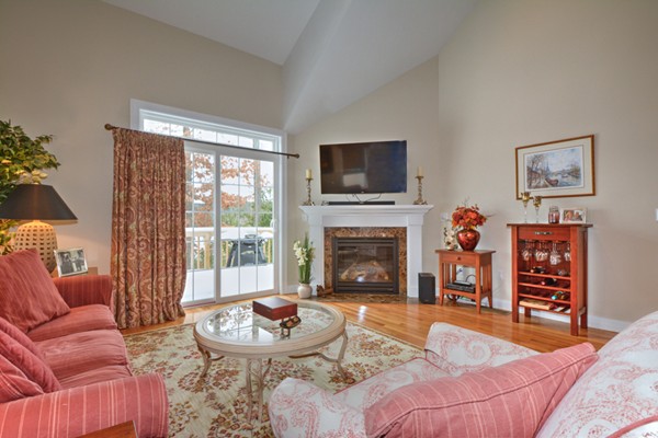 13 C Trail Ridge Way, Unit 47AR Harvard, MA 01451 - Photo 15 of 30 a living room with furniture a flat screen tv and a fireplace