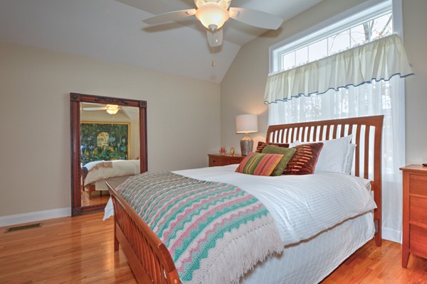 13 C Trail Ridge Way, Unit 47AR Harvard, MA 01451 - Photo 18 of 30 a bedroom with a large bed and a chandelier