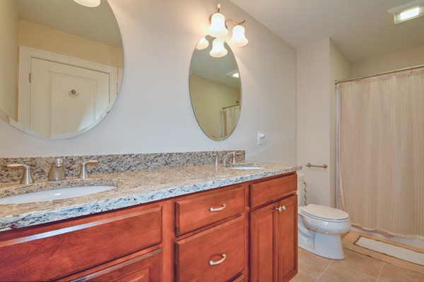 13 C Trail Ridge Way, Unit 47AR Harvard, MA 01451 - Photo 21 of 30 a bathroom with a toilet a sink and mirror