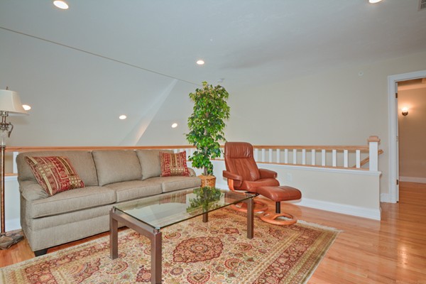 13 C Trail Ridge Way, Unit 47AR Harvard, MA 01451 - Photo 24 of 30 a living room with furniture and a wooden floor