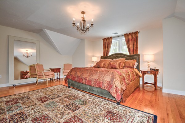 13 C Trail Ridge Way, Unit 47AR Harvard, MA 01451 - Photo 25 of 30 a bedroom with a bed and wooden floor