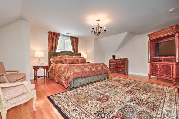 13 C Trail Ridge Way, Unit 47AR Harvard, MA 01451 - Photo 26 of 30 a bedroom with a bed and dresser with mirror