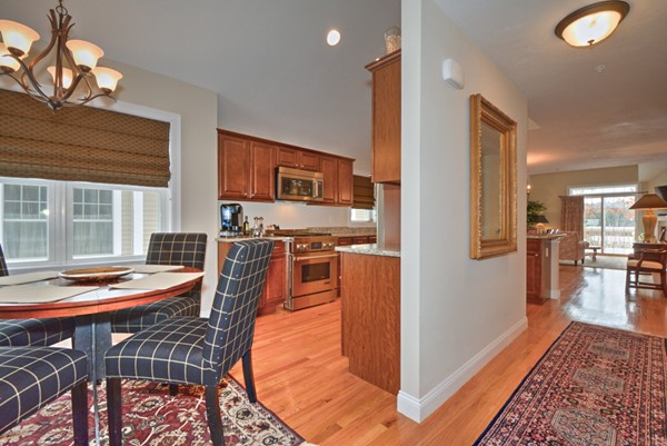 13 C Trail Ridge Way, Unit 47AR Harvard, MA 01451 - Photo 5 of 30 a view of a dining room with furniture and wooden floor