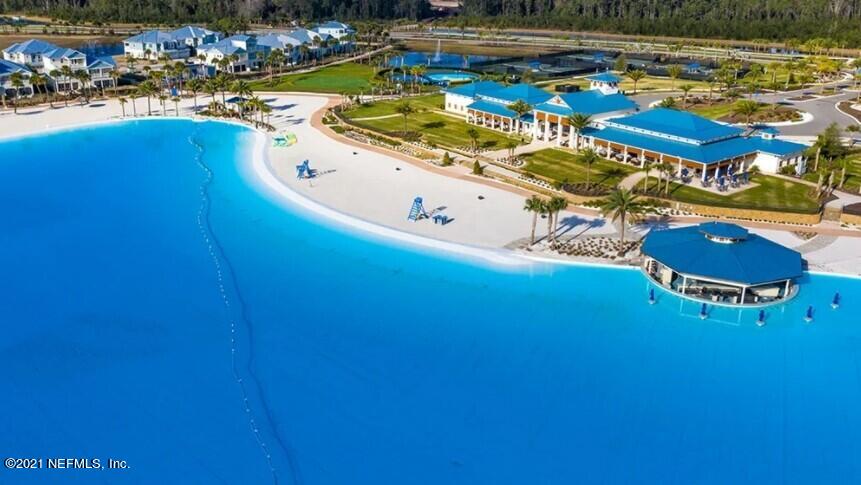 598 Marquesa Circle St. Johns, FL 32259 - Photo 14 of 16 a view of a swimming pool with lawn chairs and plants