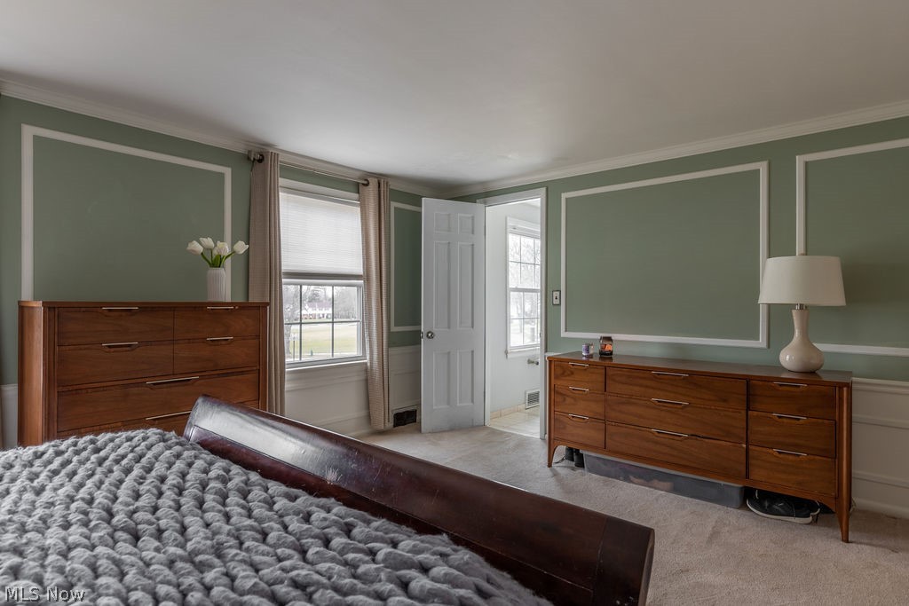 22732 Rye Road Beachwood, OH 44122 - Photo 17 of 27 The primary bedroom has elegant trimwork and access to the en suite bathroom.