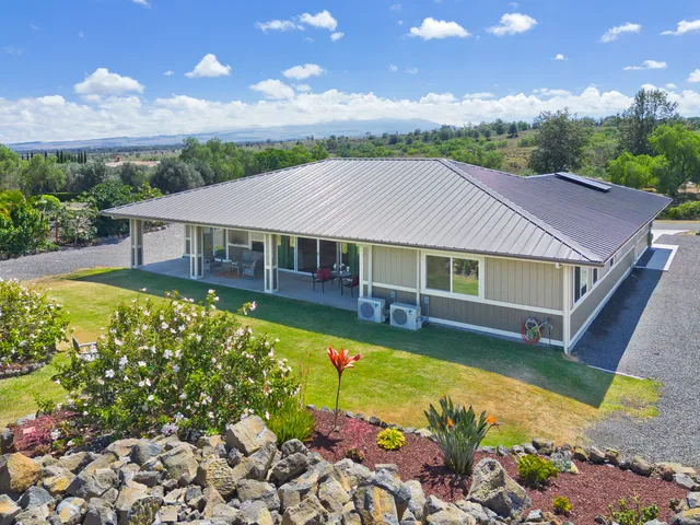 a aerial view of a house with a big yard