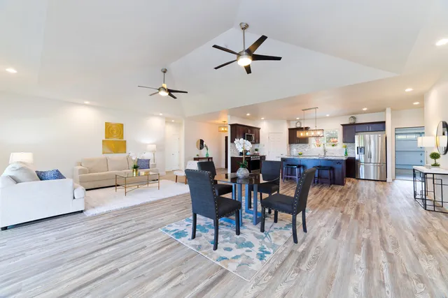 a view of a dining room with furniture and wooden floor