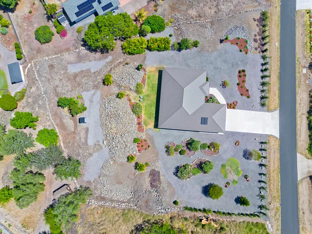an aerial view of a house with outdoor space