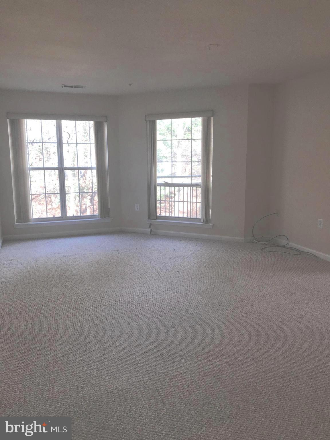 7053 Toby Drive, Unit 7053 Baltimore, MD 21209 - Photo 9 of 19 Huge Family Room floor to ceiling windows