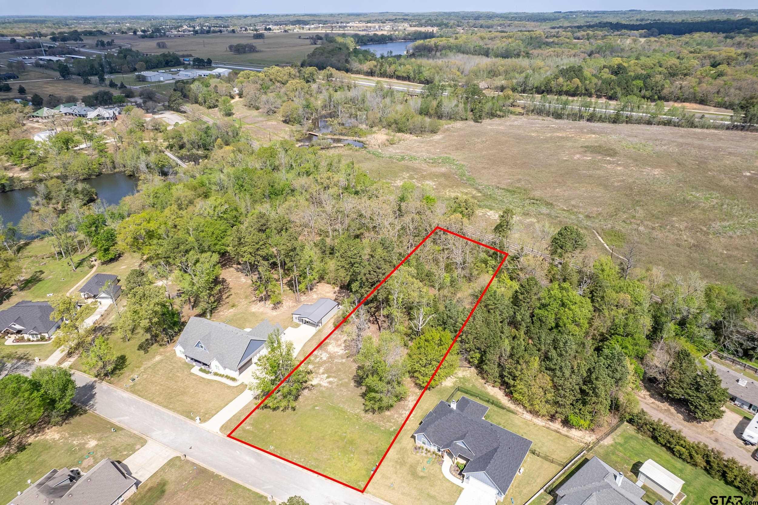 24070 Sun Ridge Road Lindale, TX 75771 - Photo 1 of 20 an aerial view of residential houses with outdoor space