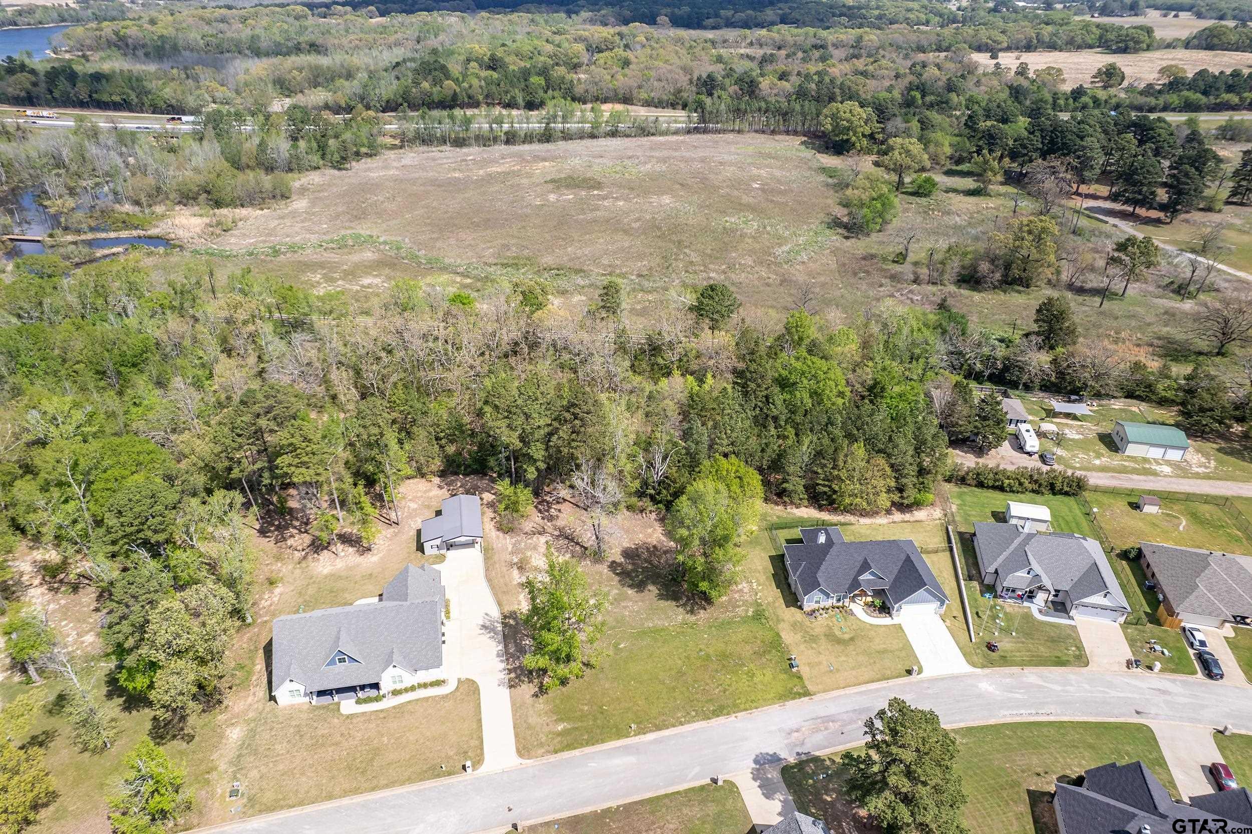 24070 Sun Ridge Road Lindale, TX 75771 - Photo 11 of 20 an aerial view of residential houses with outdoor space