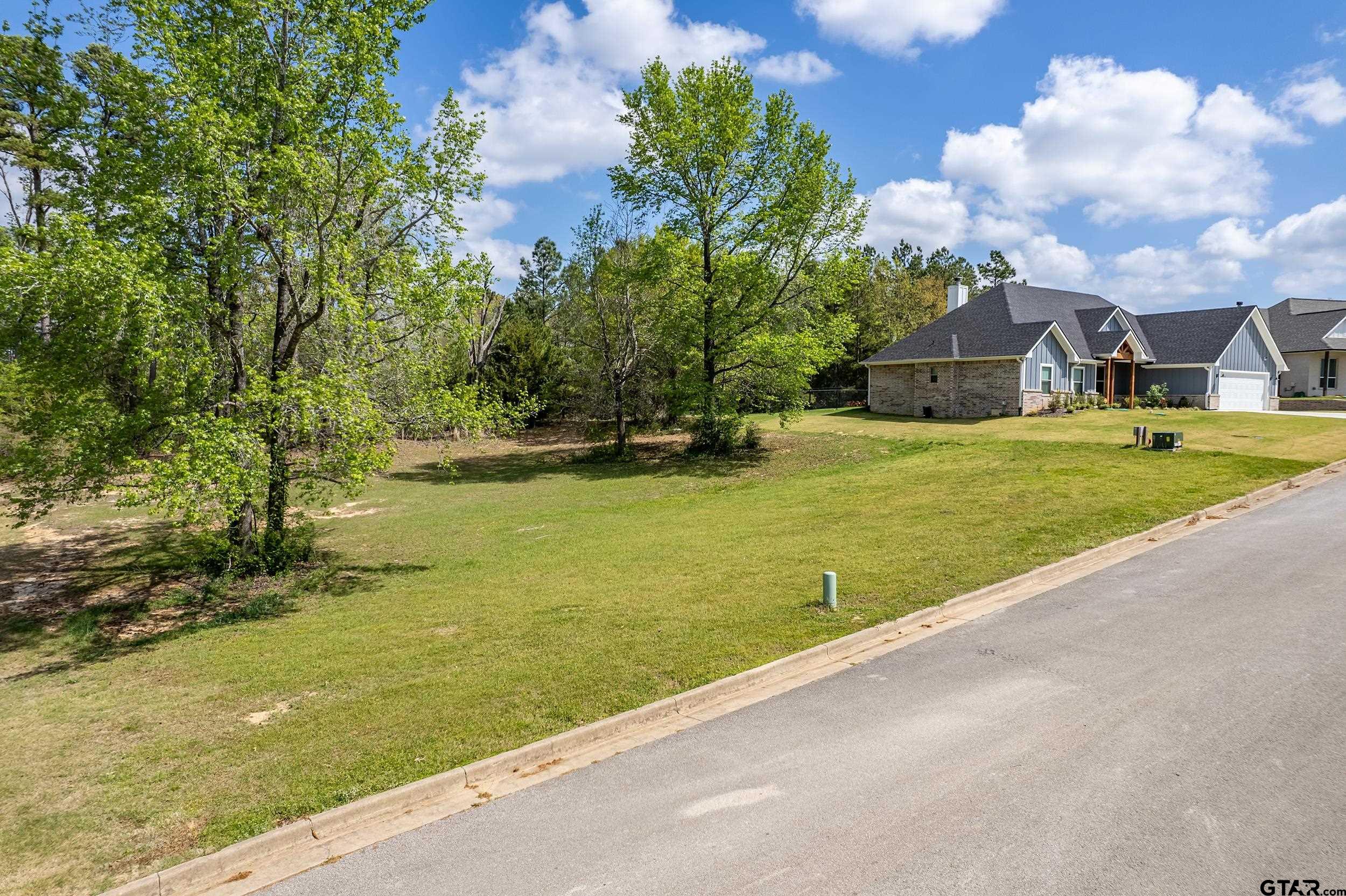 24070 Sun Ridge Road Lindale, TX 75771 - Photo 3 of 20 a view of a houses with yard and lake view