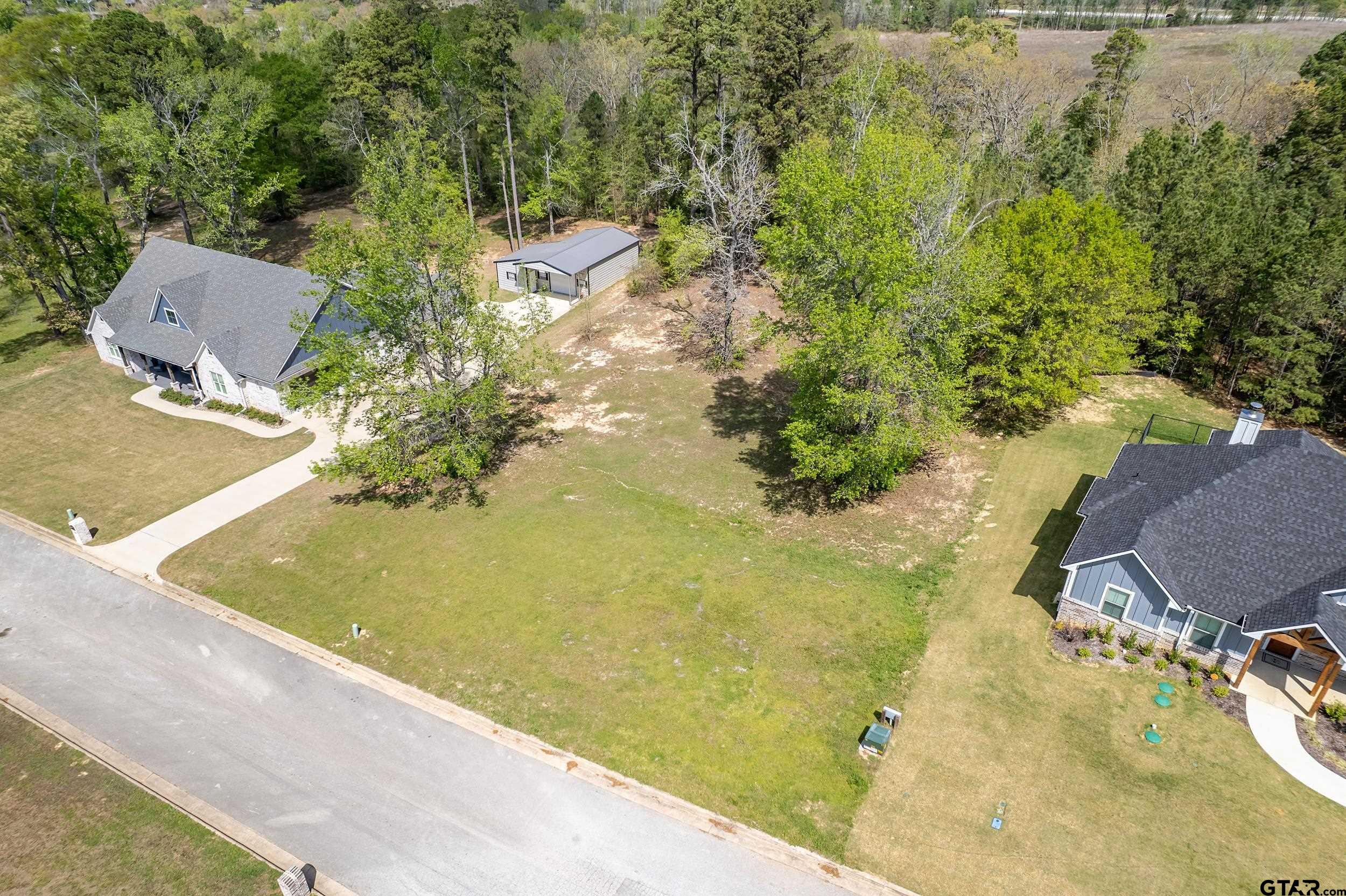 24070 Sun Ridge Road Lindale, TX 75771 - Photo 9 of 20 a view of a swimming pool