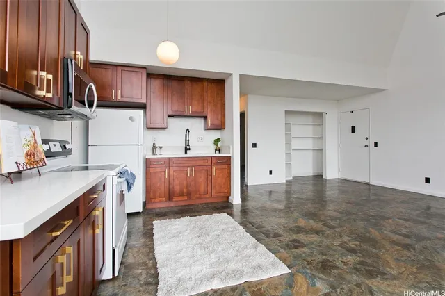a kitchen with a sink and wooden cabinets